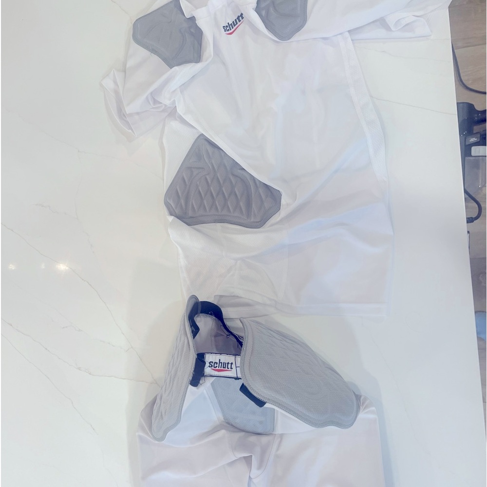 Schutt football girdle and padded compression shirt.